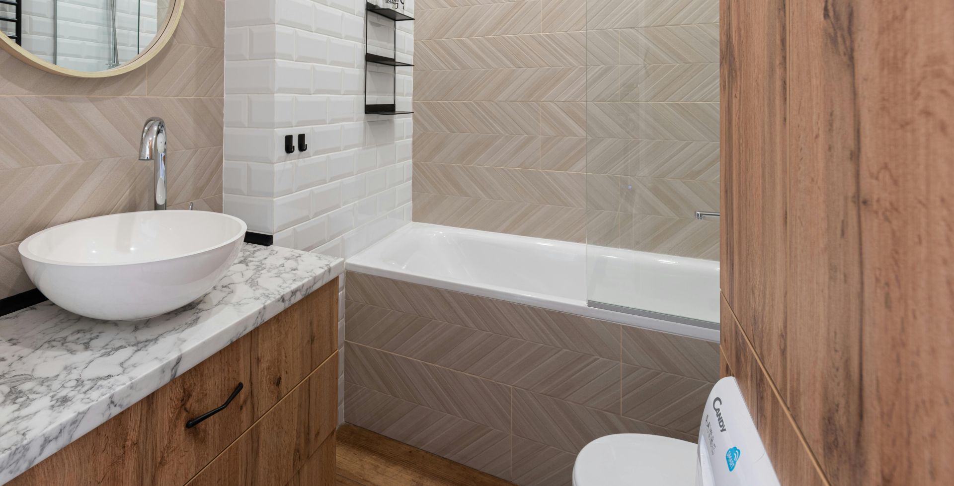 Bathroom interior with sink on counter near mirror and bath