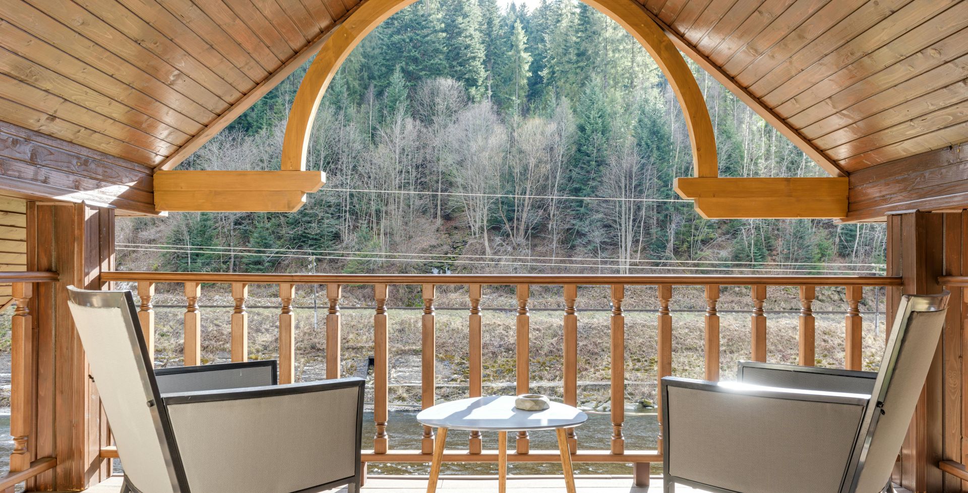 Wooden Balcony on Attic with Steel Framed Chairs